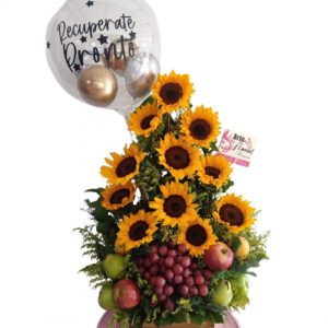 Arreglo floral con frutas en girasoles floristeria cali